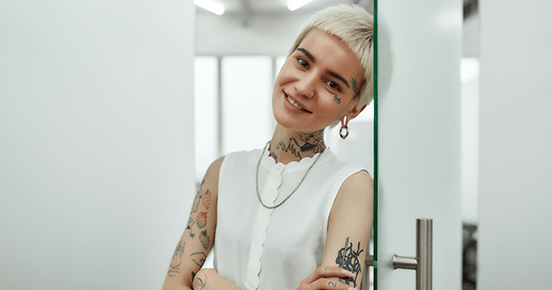 Short-haired young woman with tattoos